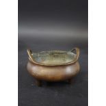 CHINESE BRONZE CENSER - SEAL MARK a small bronze censer with curved handles and supported on three