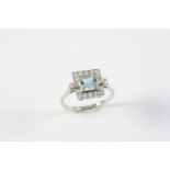 AN AQUAMARINE AND DIAMOND CLUSTER RING the square-shaped aquamarine is set within a surround of