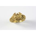 AN EARLY 19TH CENTURY SILVER GILT RING engraved with a mask and with initials, J.H. P.