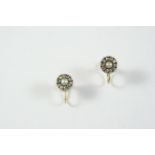 A PAIR OF VICTORIAN PEARL AND DIAMOND EARRINGS the central half pearl is set within a surround of