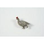 A VICTORIAN DIAMOND GROUSE BROOCH set overall with circular-cut diamonds in silver and gold, with