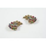 A PAIR OF DIAMOND AND GEM SET EARCLIPS each mounted with old-cut diamonds, calibre-cut rubies and