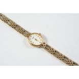 A LADY'S 9CT GOLD WRISTWATCH BY ROTARY the signed oval-shaped dial with baton numerals, on a 9ct