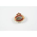 AN EARLY 20TH CENTURY ENAMEL AND DIAMOND BROOCH centred with 1903 mounted with rose-cut diamonds,