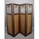 ART NOUVEAU FOLDING SCREEN - STAIN GLASS a four fold mahogany screen with brass hinges, the top