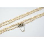 A LONG SINGLE ROW GRADUATED CULTURED PEARL NECKLACE the pearls graduate from approximately 4.3 to