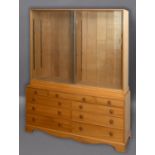 COTSWOLD SCHOOL OAK CABINET - P HENSMAN the glazed top section with sliding doors and glass shelves.