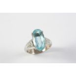 AN AQUAMARINE AND DIAMOND RING the oval-shaped aquamarine is set with six circular-cut diamonds to