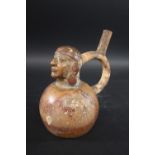 MOCHE STIRRUP VESSEL - PERU circa 1st to 5th Century AD, a pottery portrait stirrup vessel with