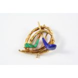 A GOLD, LAPIS LAZULI AND MALACHITE GOLFING BROOCH signed Chaumet, Paris and with French marks, circa