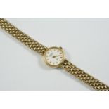 A LADY'S 9CT GOLD WRISTWATCH BY ROTARY the signed circular dial with baton numerals, on a 9ct gold