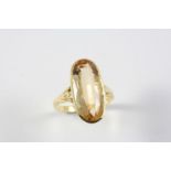 A TOPAZ SINGLE STONE RING the oval-shaped topaz is set in 18ct gold. Size M