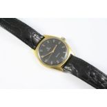 A GENTLEMAN'S STAINLESS STEEL AND GOLD WRISTWATCH BY OMEGA the signed black circular dial with baton