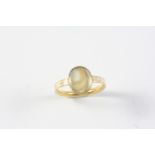 A GEORGE III GOLD AND WHITE ENAMEL MOURNING RING the centre section containing hair, with
