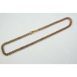 A 9CT GOLD CURB LINK WATCH CHAIN 43cm long, 42.4 grams, with 18ct gold clasp, 3.2 grams