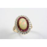 AN OPAL, RUBY AND DIAMOND CLUSTER RING the oval-shaped white opal is set within a surround of