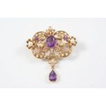 AN AMETHYST AND PEARL SET BROOCH PENDANT the foliate openwork mount is set with an oval-shaped and