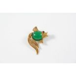 A CHRYSOPRASE AND GOLD FISH BROOCH BY HANS GEORG MAUTNER the body formed with a section of