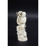 JAPANESE OKIMONO IVORY FIGURE - SIGNED Meiji period, a carved figure of a gentleman standing on