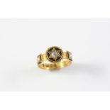 A GOLD, BLACK ENAMEL, PEARL AND DIAMOND MOURING RING the central cushion-shaped diamond set within a