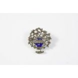 A 19TH CENTURY ENAMEL AND MARCASITE GIARDINETTO BROOCH mounted with blue and white enamel