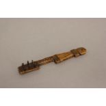 A 19TH CENTURY TREEN LATCH KEY. An unusual treen key, the rectangular end with six peg like