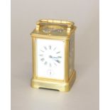 A 19th CENTURY BRASS CASED CARRIAGE CLOCK. With a rectangular white enamelled dial with Roman
