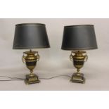 A PAIR OF EMPIRE STYLE BRONZE AND ORMOLU TABLE LAMPS. Each of vase form with gilt rims and bases,