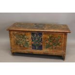 A CONTINENTAL PAINTED COFFER. With a rectangular rising top above a panel effect painted front