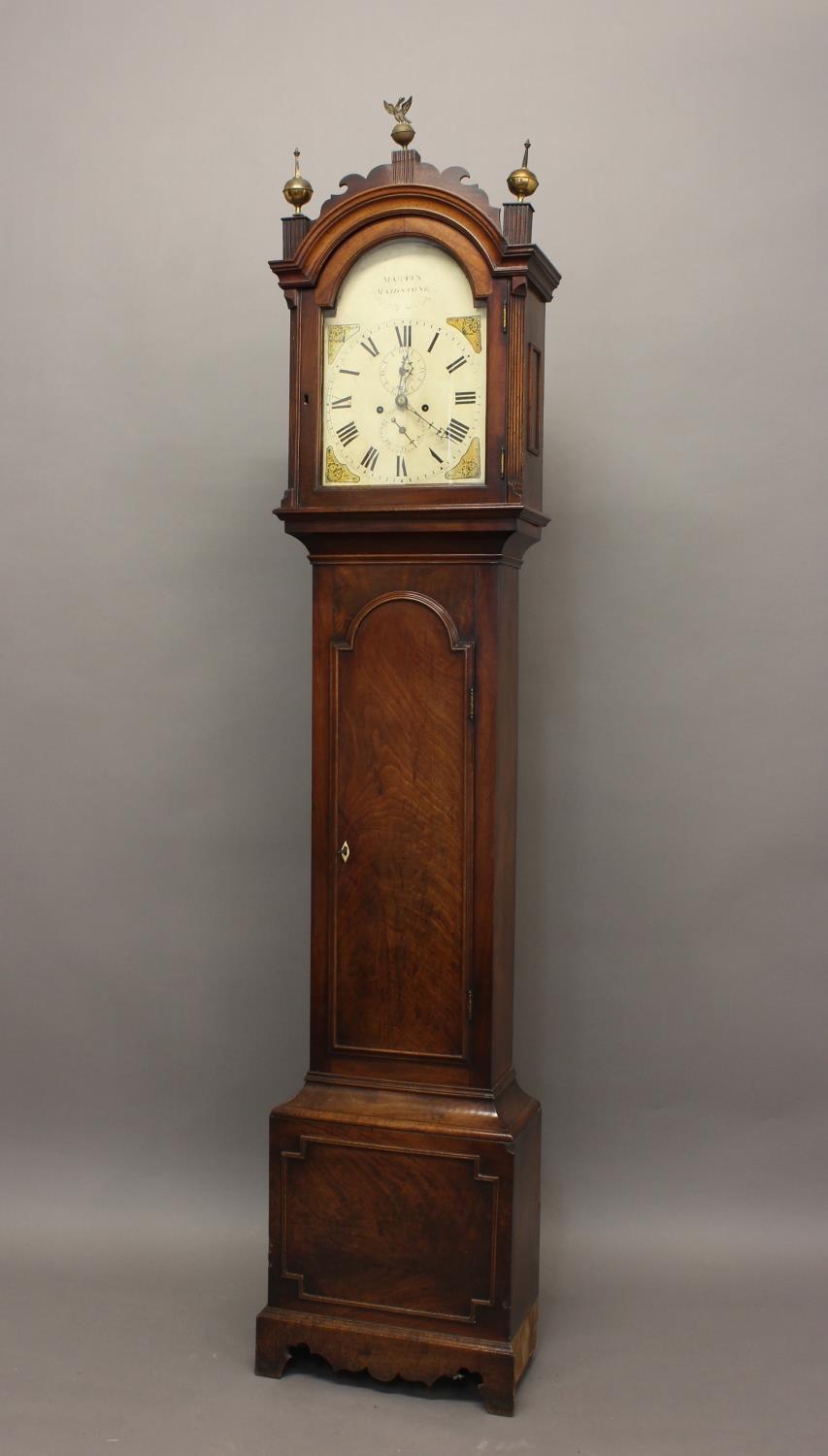 AN EARLY 19TH CENTURY MAHOGANY LONGCASE CLOCK. With an arched painted dial with Roman numerals and