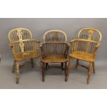 THREE SIMILAR BEECH AND ELM WINDSOR ARMCHAIRS. Each with arched backs, curved arm supports and a