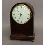 A REGENCY MAHOGANY BRACKET CLOCK BY DWERRIHOUSE AND CARTER. With a circular convex dial with Roman