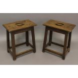 AN UNUSUAL PAIR OF 18TH CENTURY JOINT STOOLS. With rectangular tops with moulded borders and pierced