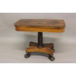 A REGENCY ROSEWOOD AND BRASS STRUNG TEA TABLE. The rectangular fold top with rounded corners and two