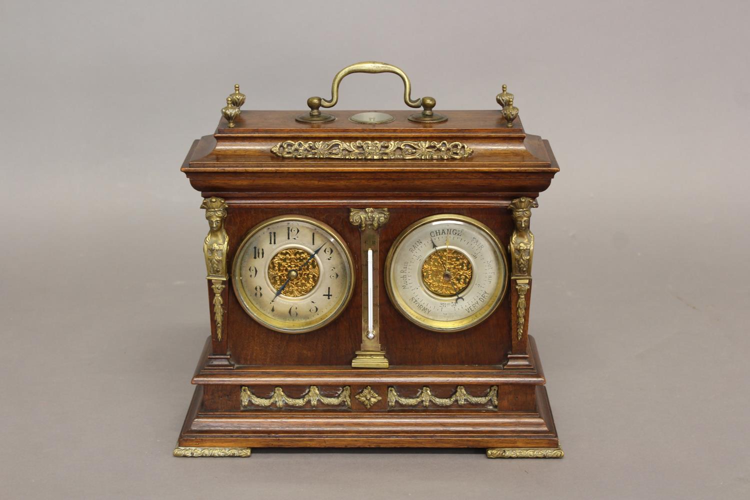 A PRESENTATION CLOCK/BAROMETER BY E. SERMON, TORQUAY. The walnut case with carrying handle above a