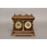 A PRESENTATION CLOCK/BAROMETER BY E. SERMON, TORQUAY. The walnut case with carrying handle above a