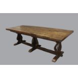 A 17TH CENTURY STYLE ELM TOPPED REFECTORY DINING TABLE. With a broad three plank top with clamped