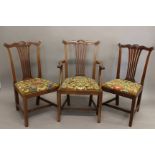 A SET OF FOURTEEN GEORGE III STYLE MAHOGANY DINING CHAIRS. COmprising twelve standard and two arm