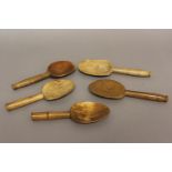A COLLECTION OF FIVE WELSH BUTTER SPOONS. Five 19th century Welsh butter spoons, each with broad