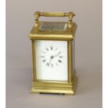 A LATE 19th CENTURY BRASS CASED CARRIAGE CLOCK. With a rectangular white enamelled dial with Roman