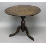 A LATE 17TH CENTURY TRIPOD TABLE WITH REVOLVING TOP. With a circular tilting top with moulded