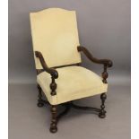 A WILLIAM AND MARY STYLE OPEN UPHOLSTERED ARM CHAIR. With an arch topped rectangular back, scrolling