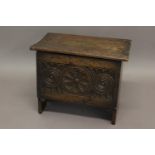 AN OAK SMALL COFFER IN 17TH CENTURY STYLE with carved front; 54 cms