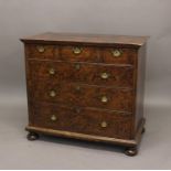 A QUEEN ANNE STYLE 'MULBERY' VENEERED CHEST OF DRAWERS. With a rectangular top with moulded