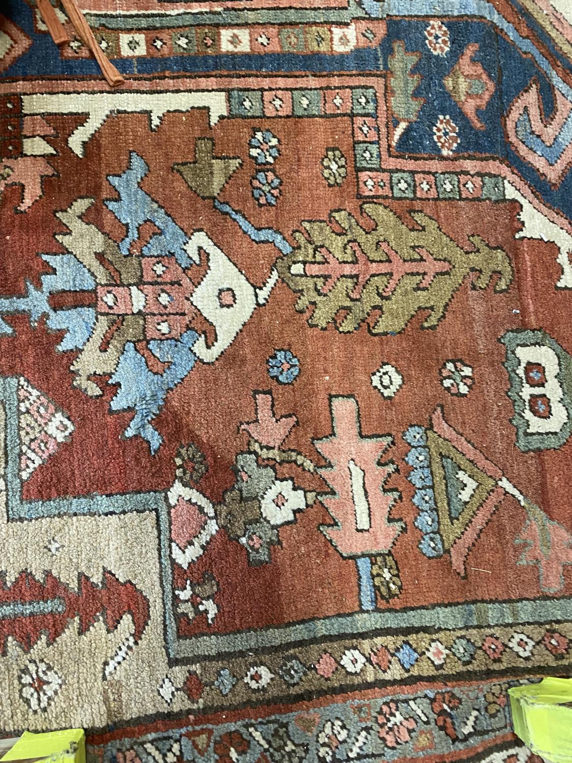 A HERIZ CARPET c1870. Iranian Azerbaijan, The stepped terracotta fields centred by an indigo and - Image 13 of 16