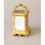 A GILT BRASS CASED CARRIAGE CLOCK BY BOLVILLER OF PARIS. With a rectangular white enamelled dial