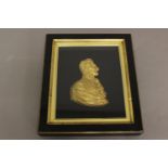 A GILT METAL RELIEF PROFILE PORTRAIT OF THE DUKE OF WELLINGTON. Side profile of the Duke with bare