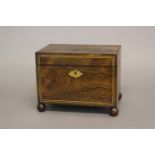 A REGENCY ROSEWOOD AND BRASS INLAID TEA CADDY. A rectangular tea caddy of generous proportions