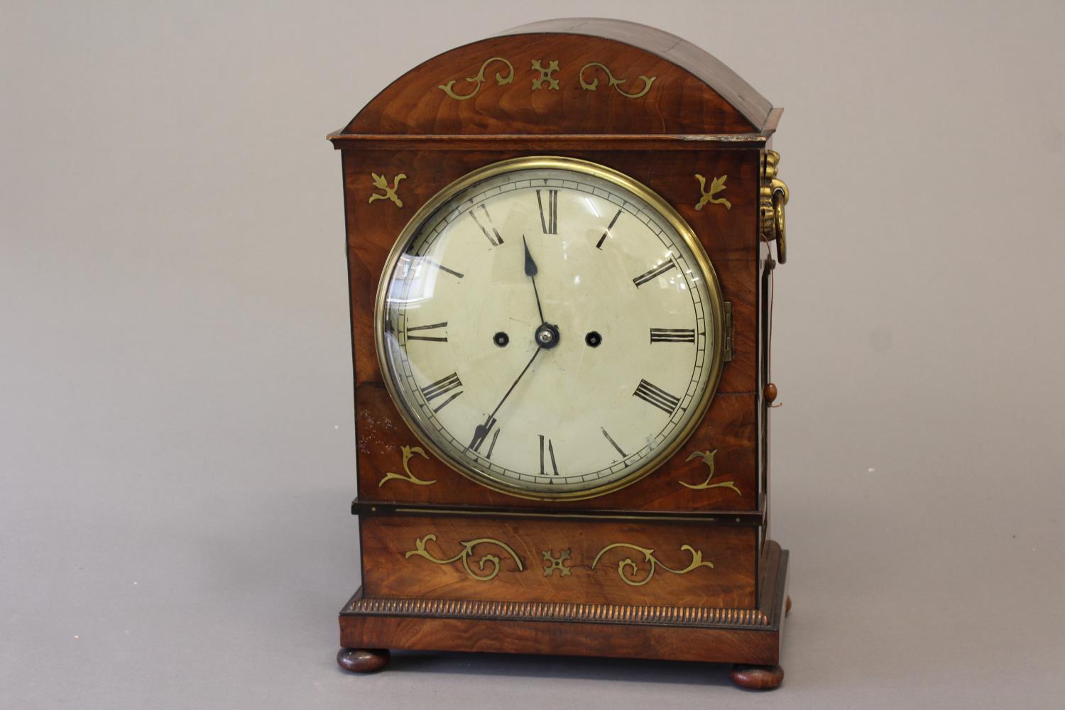 A REGENCY BRASS INLAID MAHOGANY BRACKET CLOCK. With a circular convex cream painted dial with