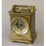 A VICTORIAN BRASS CASED MANTEL CLOCK AND BAROMETER. With a circular dial with recessed centre with